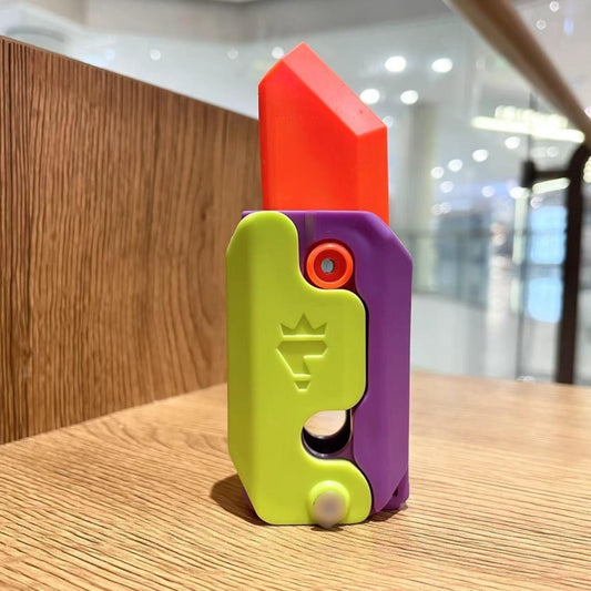 Colorful plastic gravity decompress fidget toy, purple and green with red top