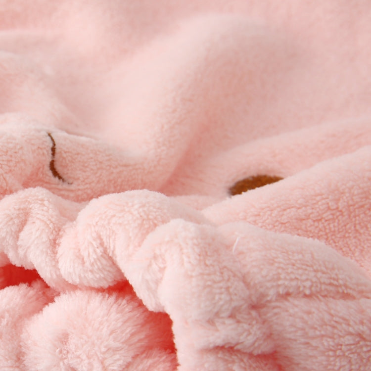 Coral velvet hair drying cap fabric close-up, plush terry texture