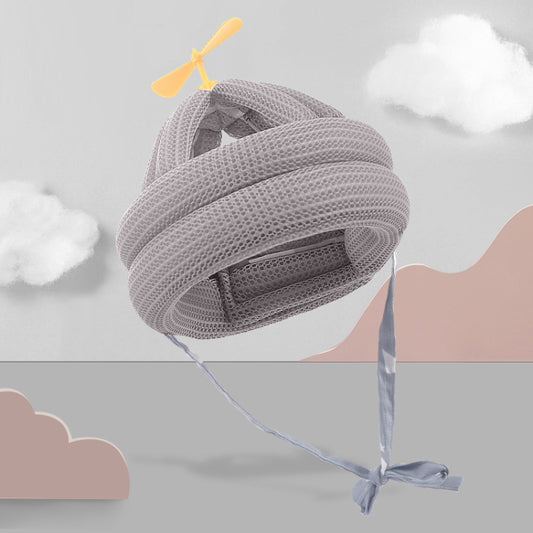 Gray mesh baby anti-fall pillow protection pad with yellow fan and tied straps