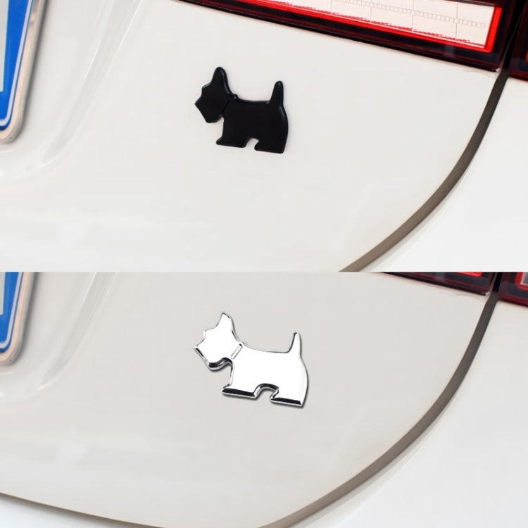 Dog car decals on white vehicle: black and silver puppy silhouette emblems.