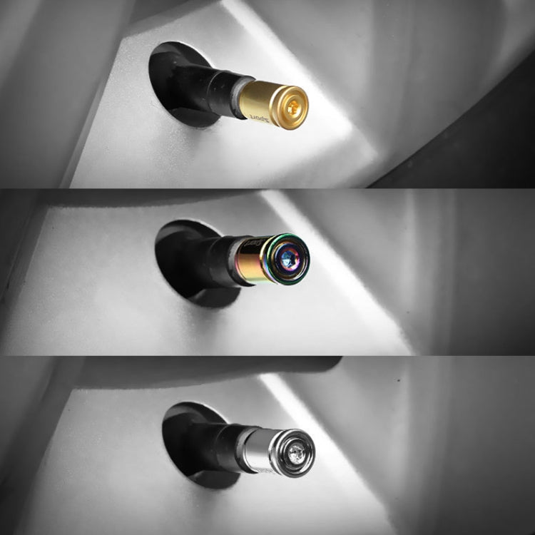 Tire valve caps fitted on wheel valve stem: gold, rainbow, and chrome