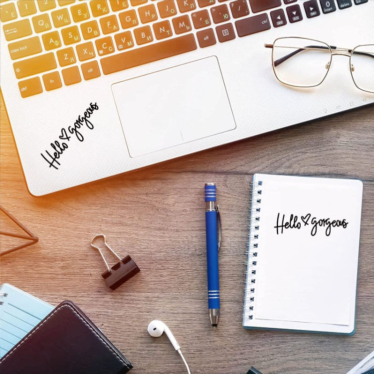 White desk card with 'Hello Gorgeous' script sticker, black lettering