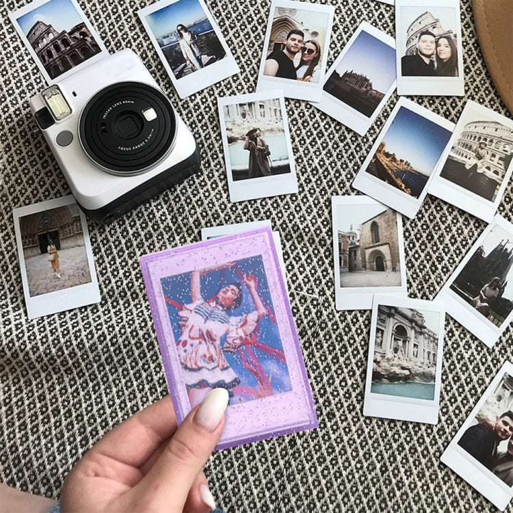 Purple glitter transparent photo card storage box with Polaroid-style card, held by hand