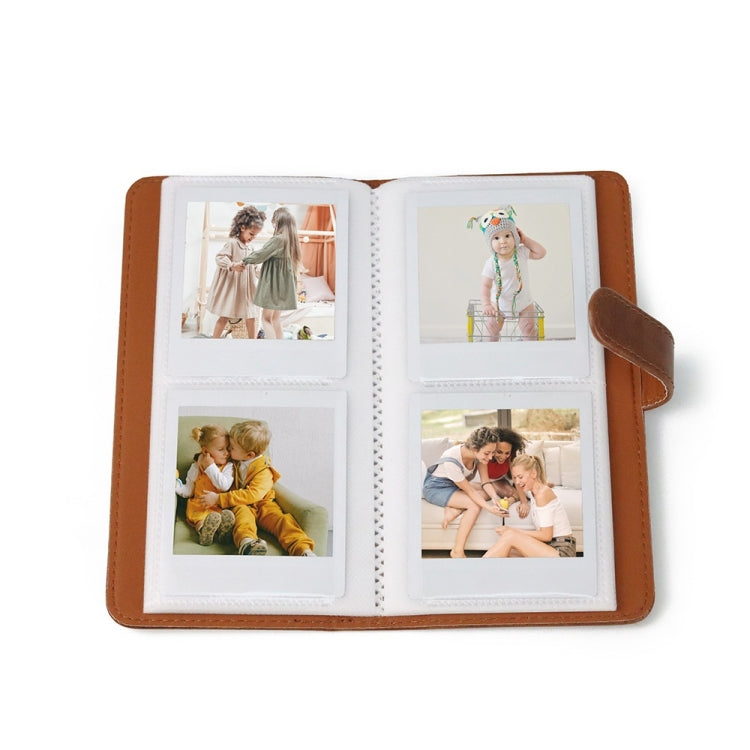 Brown photo album open with four visible photo display pockets on inner pages
