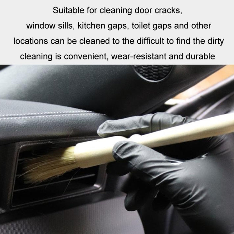 Car interior air vent cleaning brush with wood handle used with gloved hand