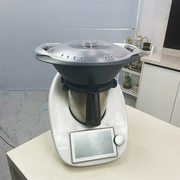 Steaming pan cover fitted on Thermomix appliance with vent holes
