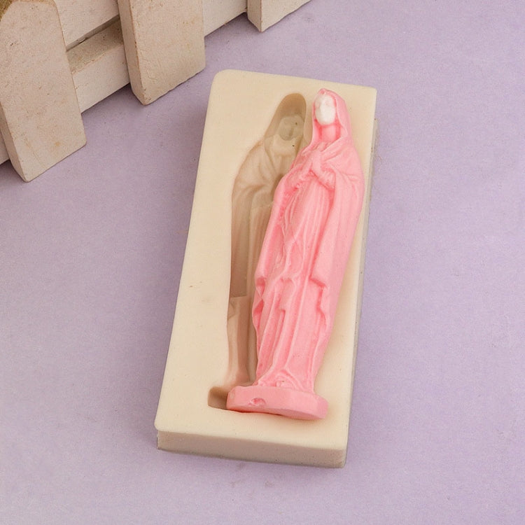 Cream silicone mold with Virgin Mary statue relief, with pink molded figure