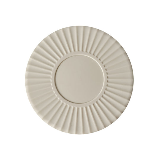 White silicone heat insulation mat with round ridged design and center insert.
