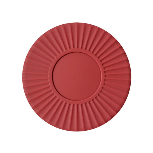Red silicone heat insulation mat with fan-like ridges and a raised round center.
