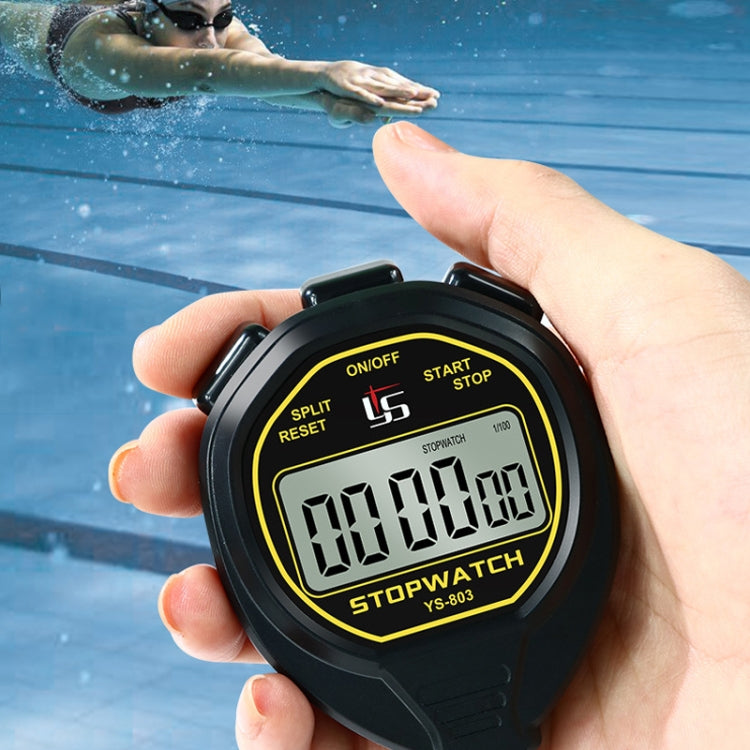 Black handheld stopwatch timer with large digital display held in a hand