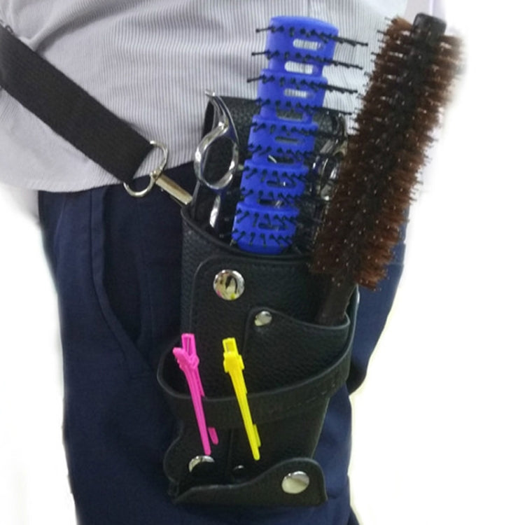 Black hair tool belt bag worn at waist with brushes and combs in pockets