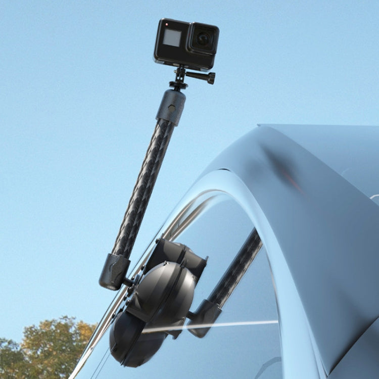 Car phone mount with carbon fiber extension arm and suction base holding a smartphone