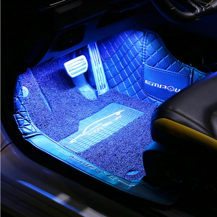 Blue LED car footwell lighting strip along the floor mat edge