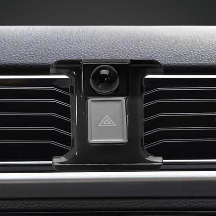 Black dashboard vent bracket base with central hazard-switch panel and camera