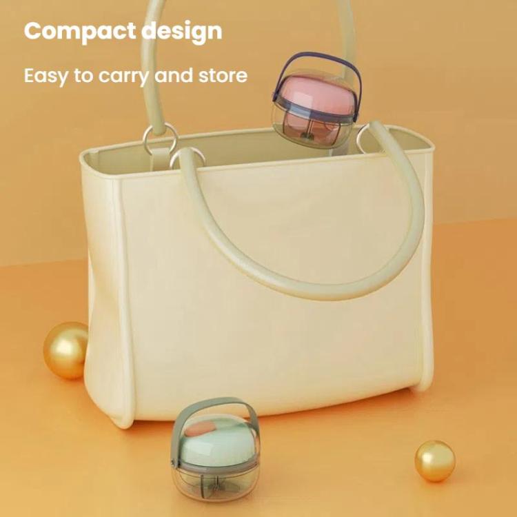 Small transparent pill box with pink lid and top carry handle