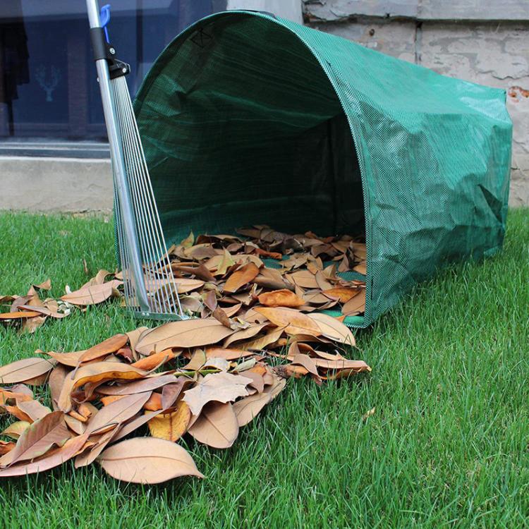 Green mesh leaf cleanup bag with large capacity, open end filled with fallen leaves