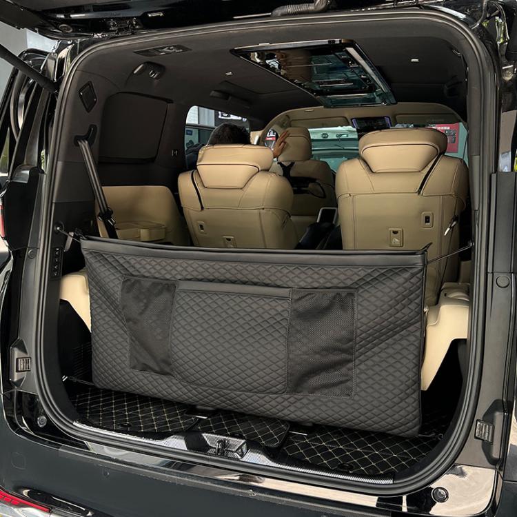 Black quilted trunk storage organizer bag across car cargo area