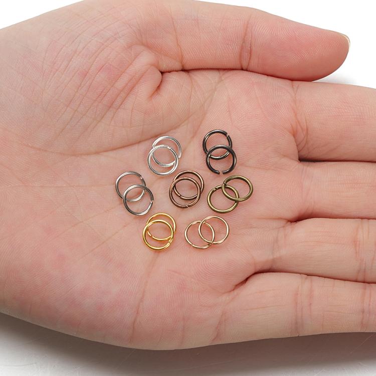 Jump rings in a hand view, mixed silver, bronze, and gold tones for DIY jewelry