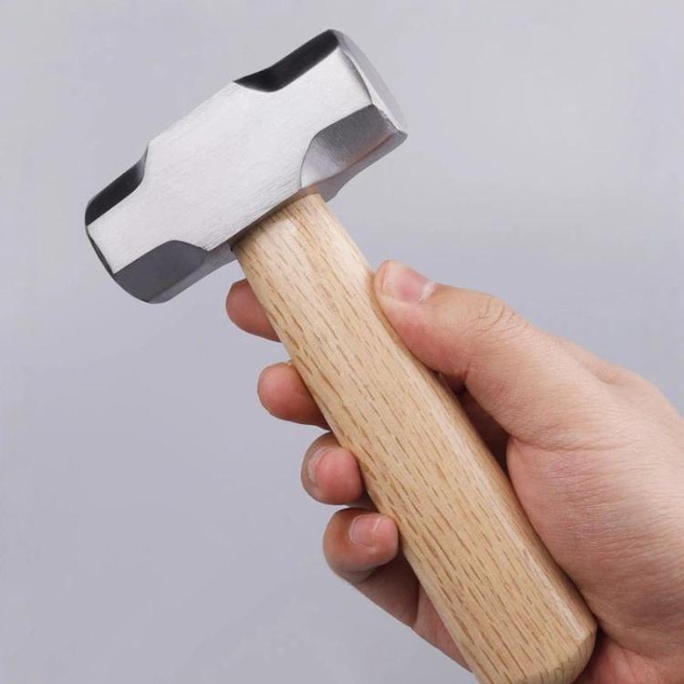 Mini hammer with solid wood handle and metal striking head, short handle
