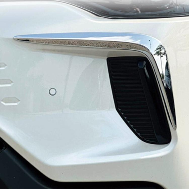 Installed front bumper fog light trim decal, chrome surround with black insert close-up