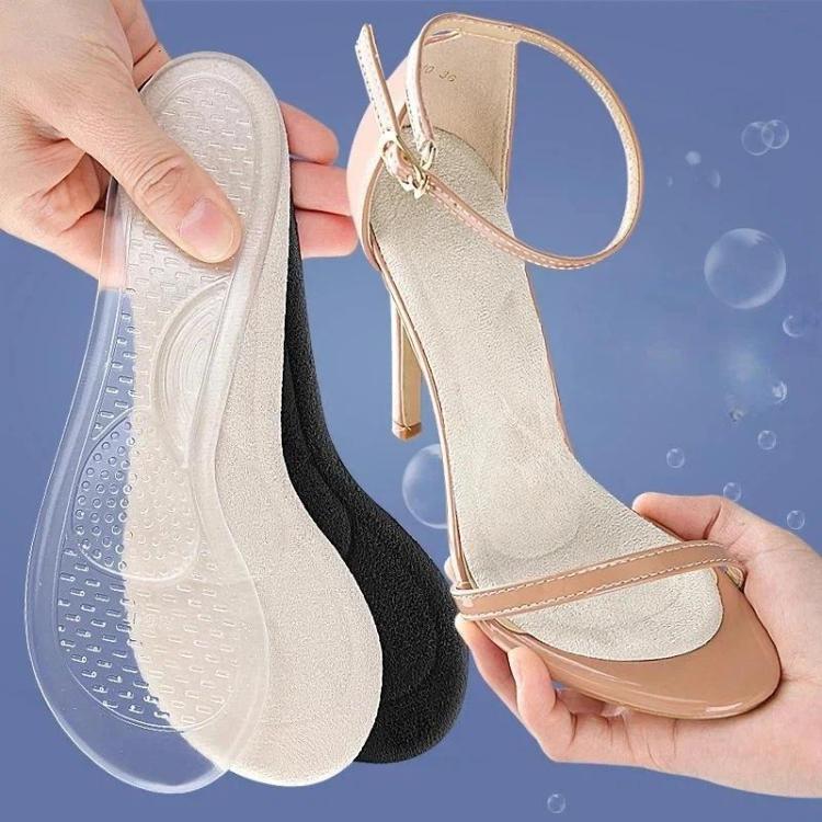Transparent and dark insole halves for half-size high-heel support, held in hand