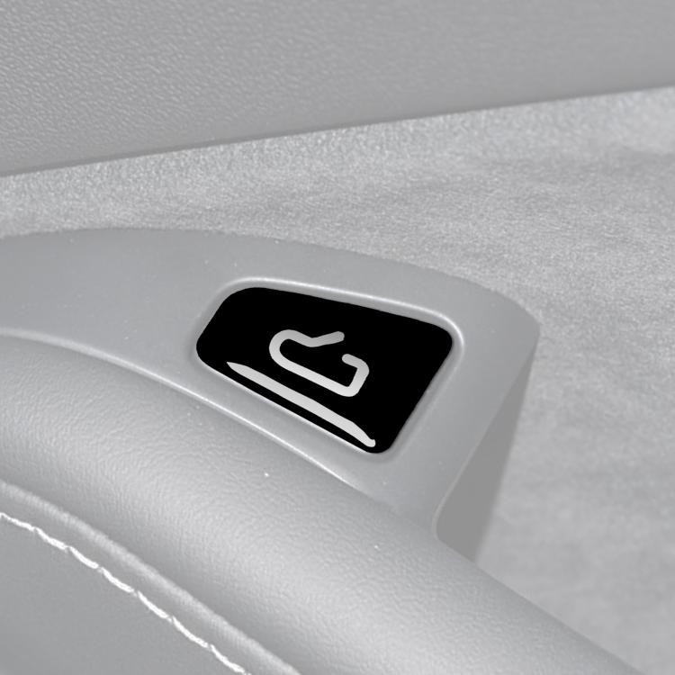 Door switch sticker with black base and white arrow icon on light gray panel