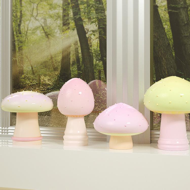 Mushroom-shaped resin or wax pieces in pink and pale yellow with grooved stems