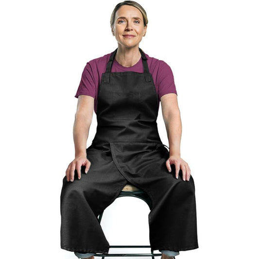 Black split-leg pottery apron with overlapping bib and front pocket; adjustable straps