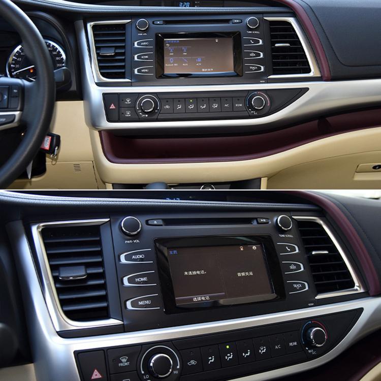 Center dashboard air vent grille and surrounding black control panel