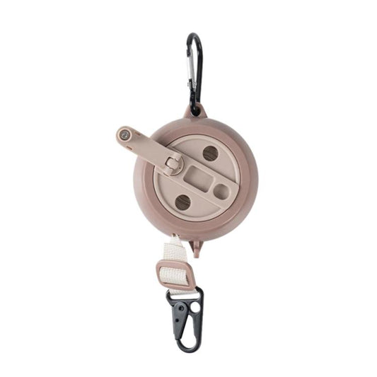 Retractable clothesline reel with beige housing, webbing strap, and carabiner hook