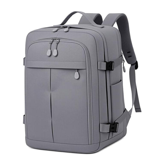 Gray travel backpack with front zip pocket, top handle, and adjustable shoulder straps