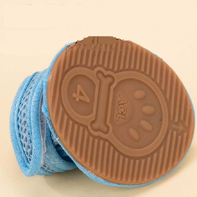 Light blue pet sandal with tan anti-skid tread sole, paw and claw grip pattern