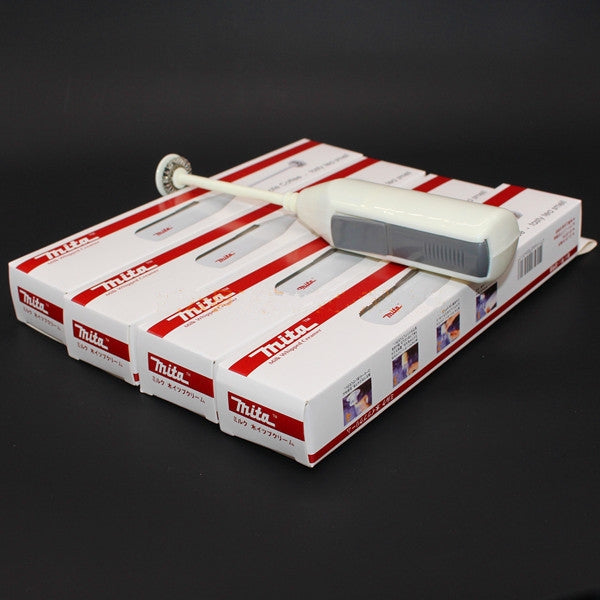 Handheld egg mixer in retail box packaging with whisk beater visible
