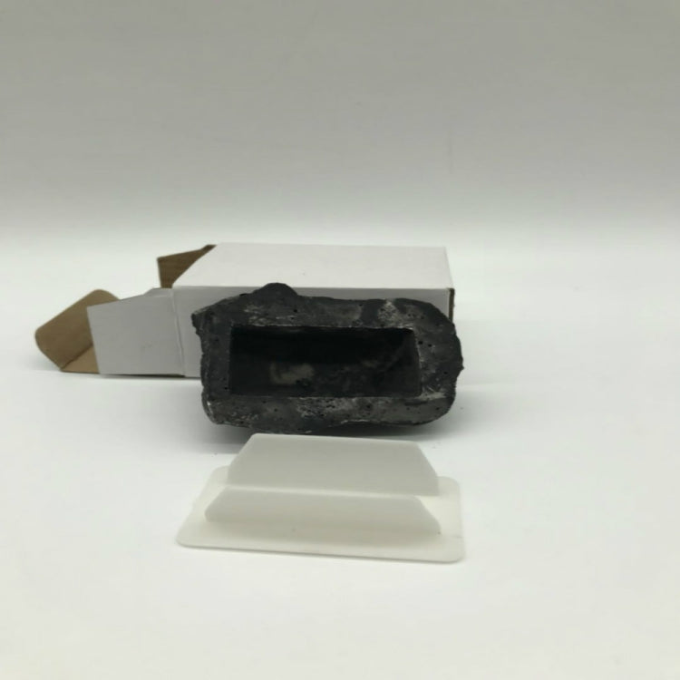 Stone key storage box with key slot and white cover plate