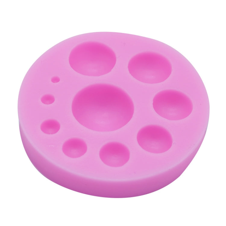 Pink round silicone fondant cake mold with oval cavities for baking decor