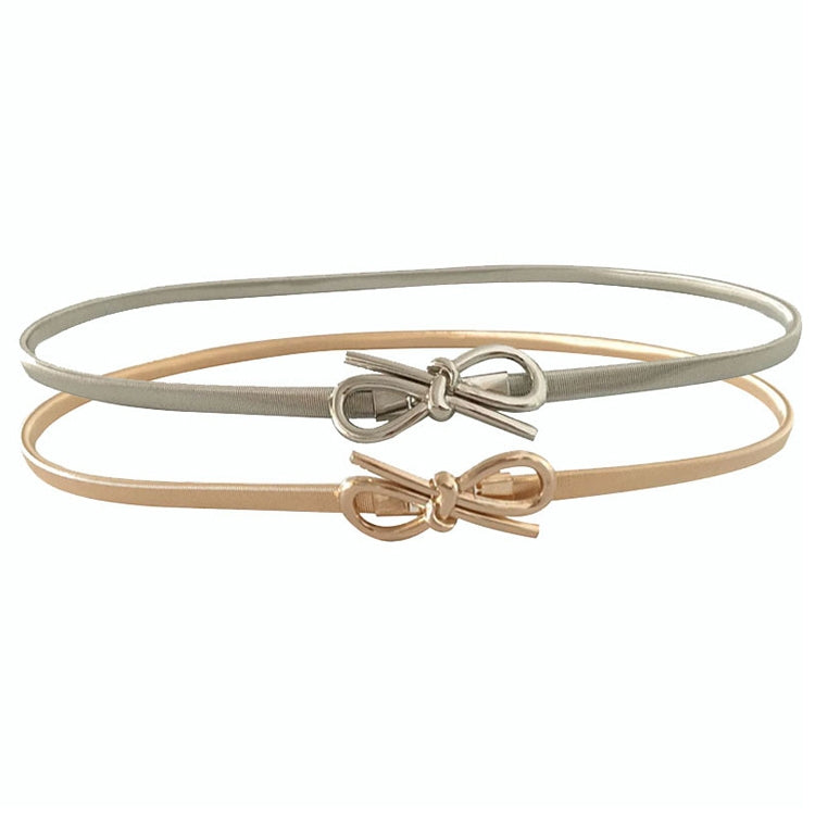Set of thin elastic belts: one gold, one silver, each with bow-knot buckle