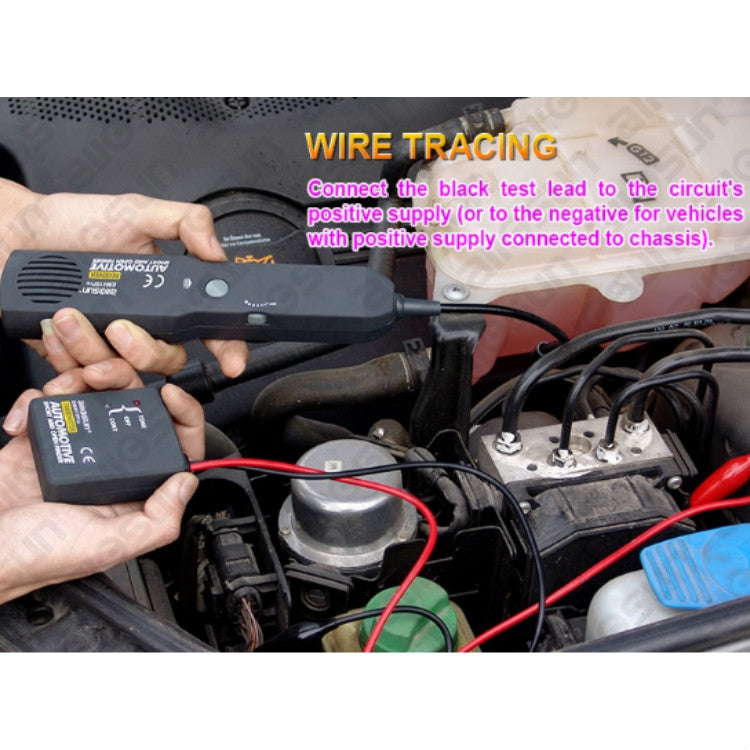Handheld wire tracing tester connected to car engine wires during circuit testing