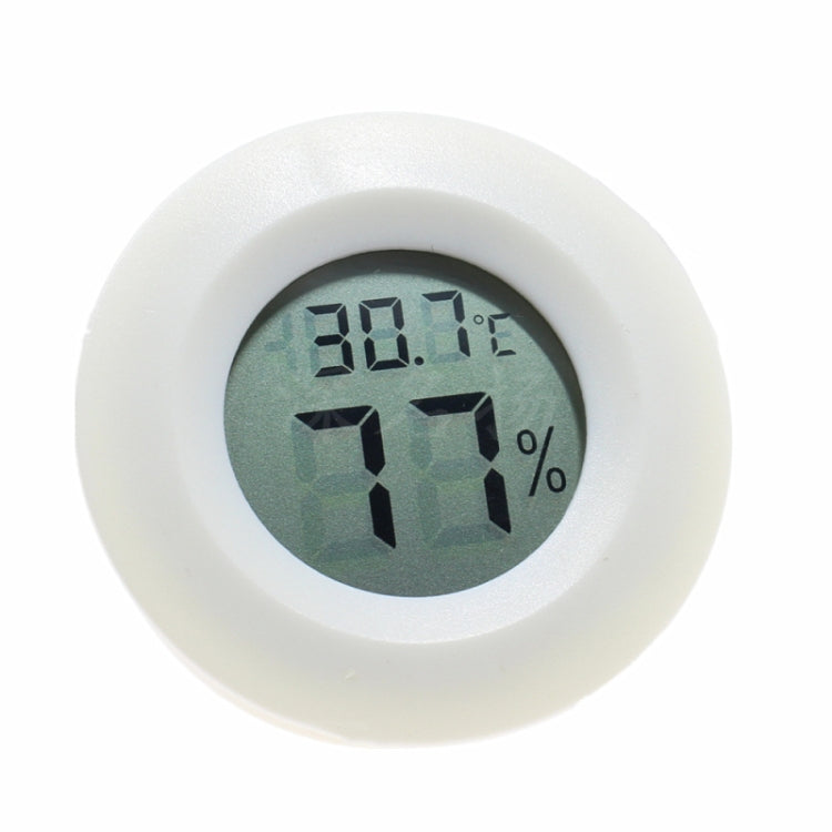 White digital LCD aquarium thermometer display, round face with °C and humidity percentage