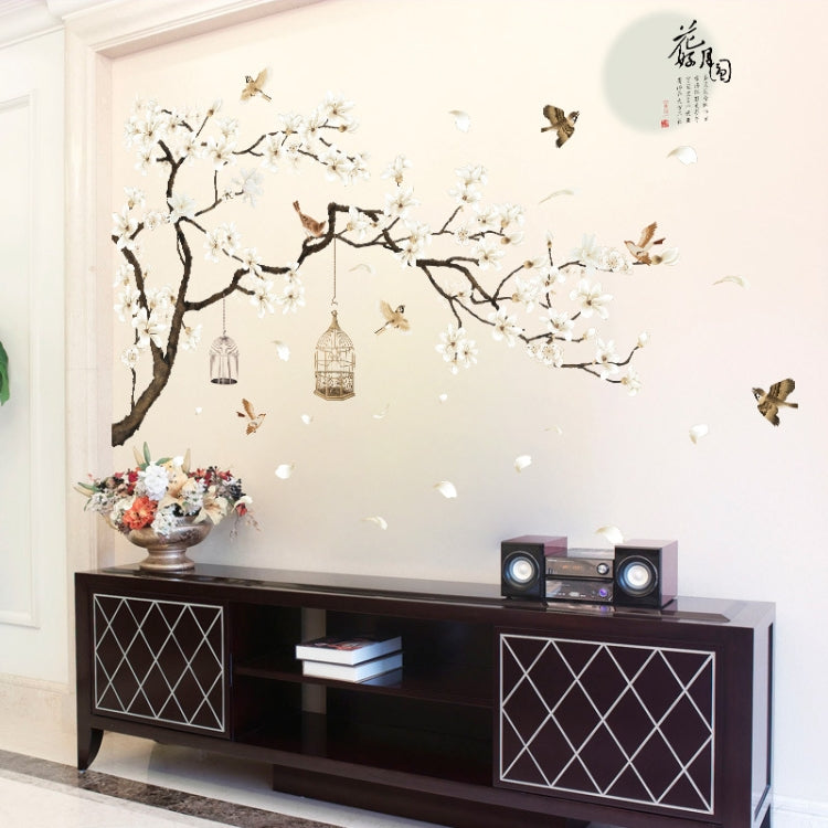 Wall decal tree branch with white blossoms, flying birds, and hanging birdcage ornaments