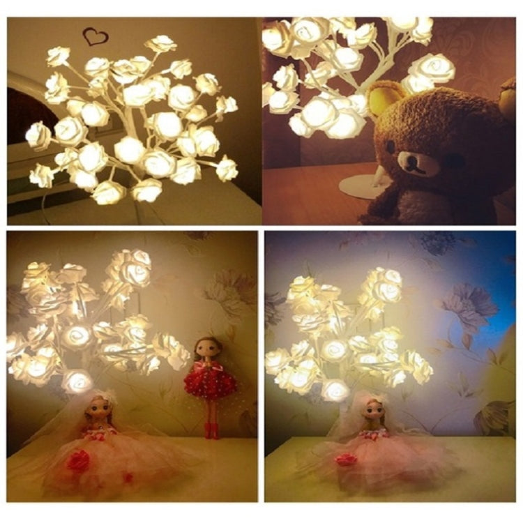 Rose night light table lamp in warm glow, showing lit faux rose blooms