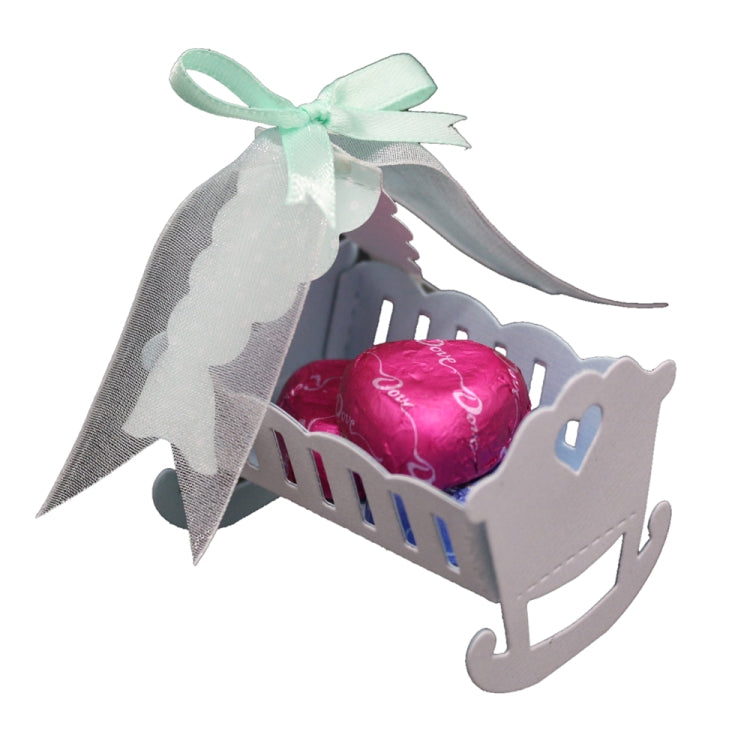 Baby cradle paper craft with pink balloon heart and mint ribbon bow, gray rocking frame