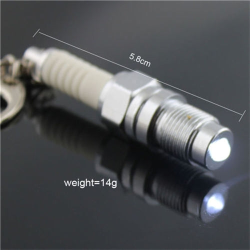 Spark plug LED keychain with glowing tip, 5.8 cm length and 14 g weight