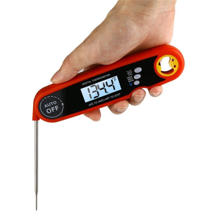 Orange digital waterproof food probe thermometer with LCD display held in hand