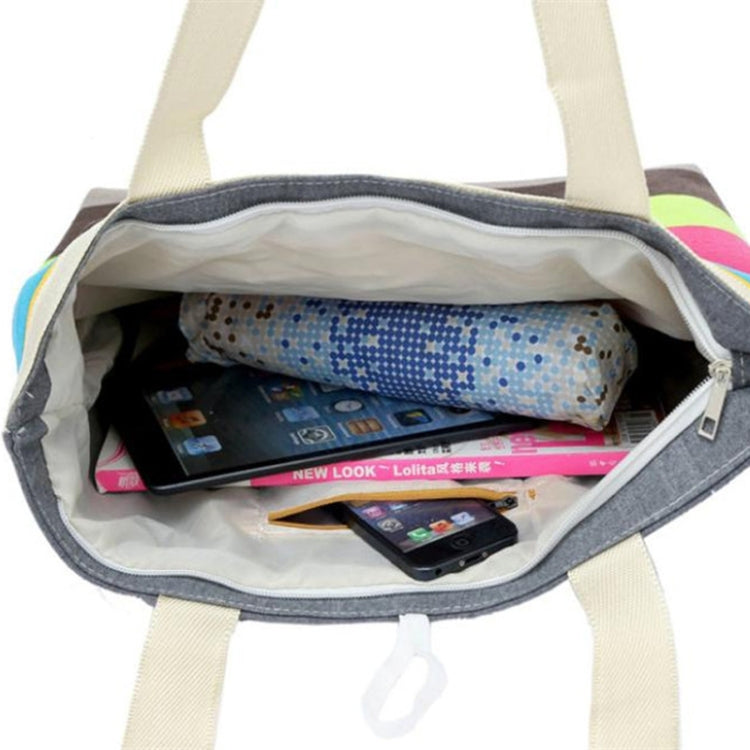 Open-top canvas tote with zipper, showing spacious interior and colorful lining