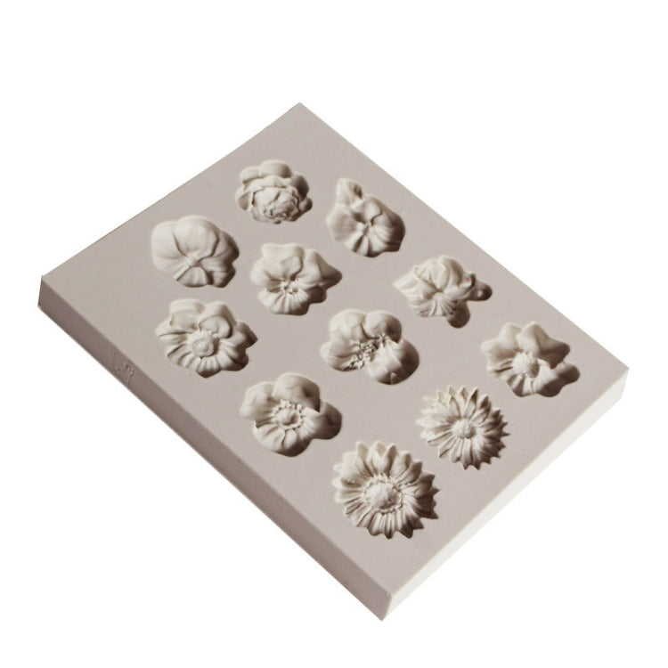 Gray silicone flower mold tray with sunflower-shaped cavities, angled view