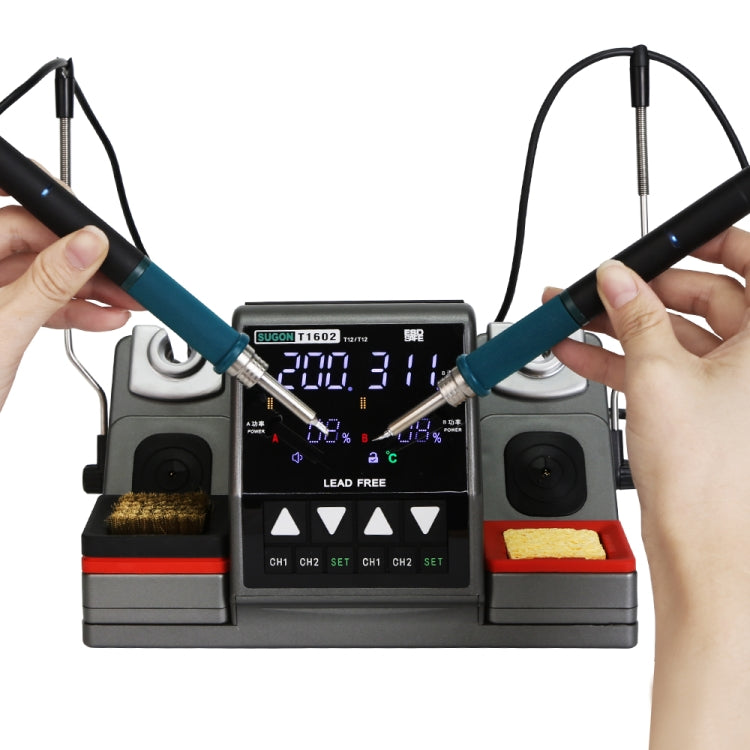 Dual station soldering station with hands holding two black-and-blue irons