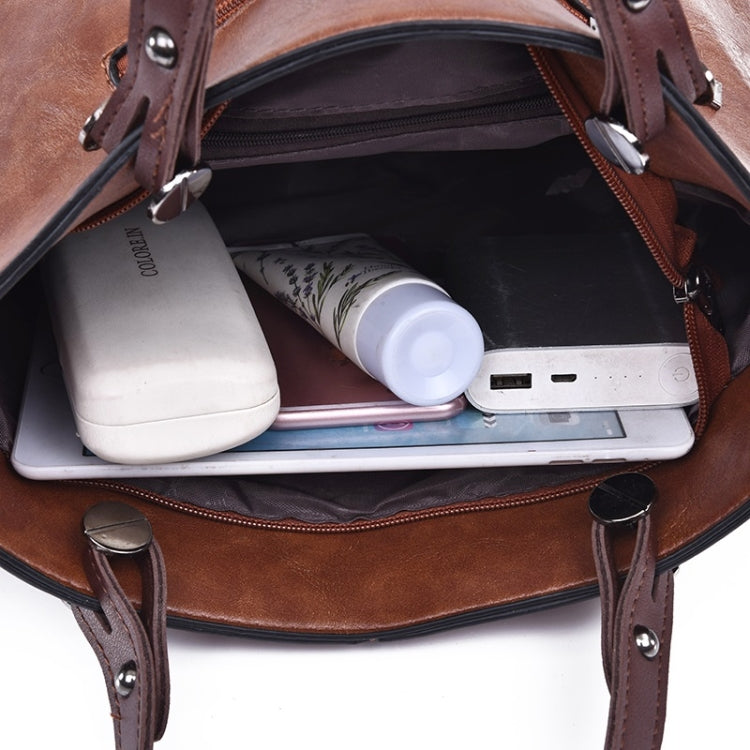 Brown PU handbag interior with zip pocket and card slot sections.