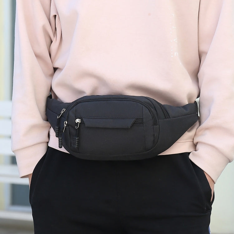 Black waist bag worn at the front with zip pockets and adjustable strap