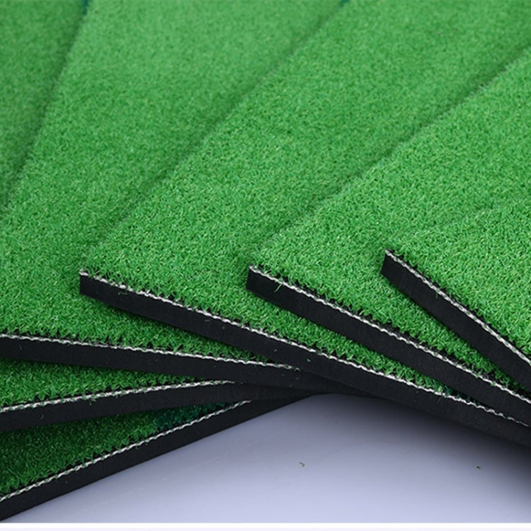 Corner view of indoor golf practice mat with black seam lines