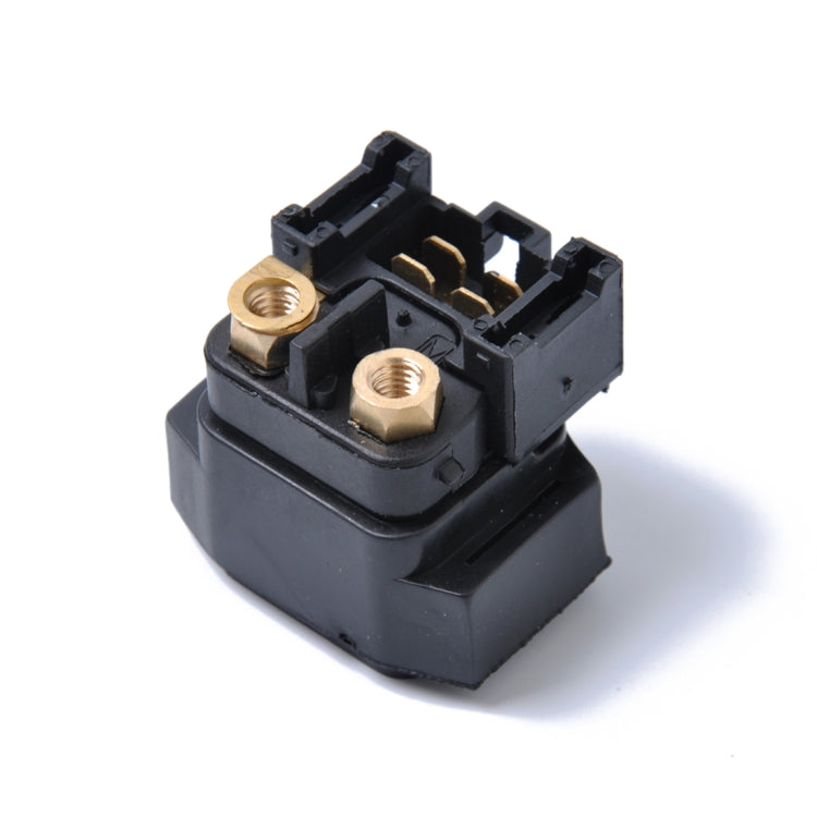 Solenoid relay angled view showing brass studs and black connector terminals